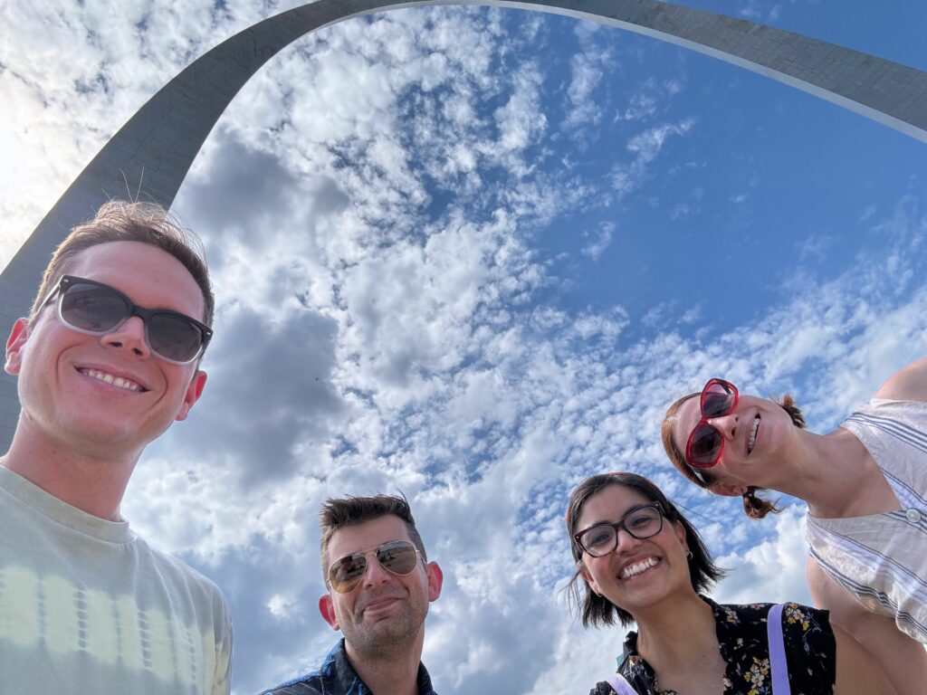 Four GEP faculty pose in front of the Gateway Arch